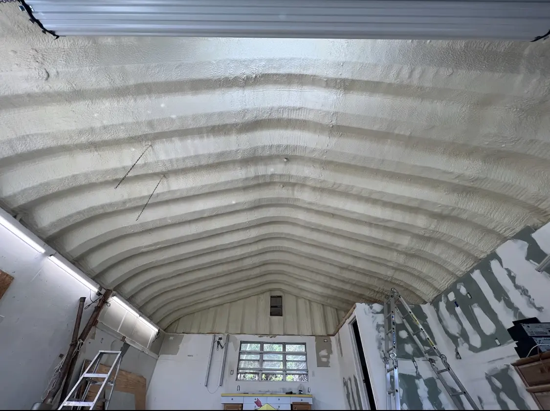 Spray polyurethane foam applied to the underside of a metal roof deck in Berea